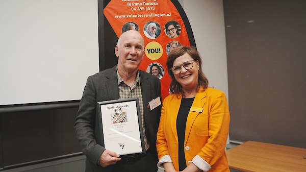 Chris receiving a volunteer award from Deputy Mayor Laurie Foon in 2023